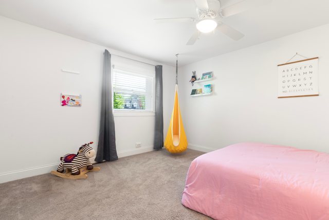 35013 North James Ingleside, IL 60041 - Photo 26 of 46 a bedroom with a bed and a chandelier