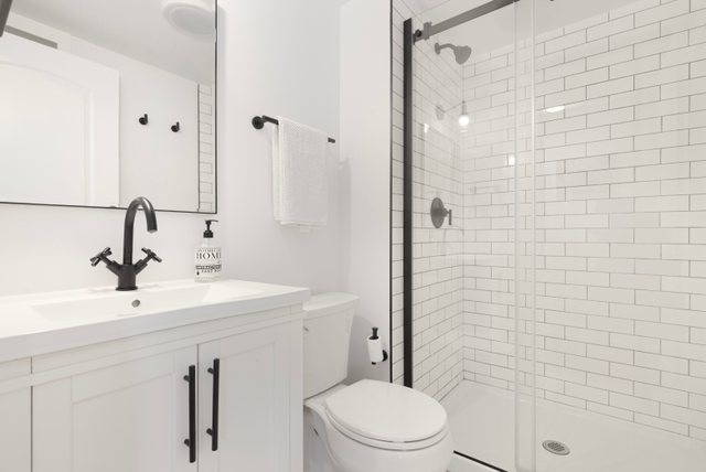 35013 North James Ingleside, IL 60041 - Photo 27 of 46 a bathroom with a sink a toilet and shower