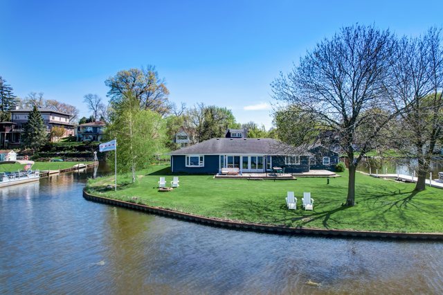 35013 North James Ingleside, IL 60041 - Photo 30 of 46 a front view of a house with garden