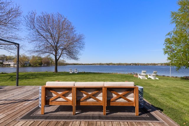 35013 North James Ingleside, IL 60041 - Photo 31 of 46 a view of swimming pool with a table and chairs under an umbrella