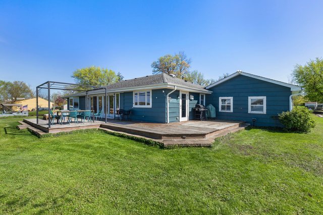 35013 North James Ingleside, IL 60041 - Photo 35 of 46 a front view of a house with a garden and swimming pool