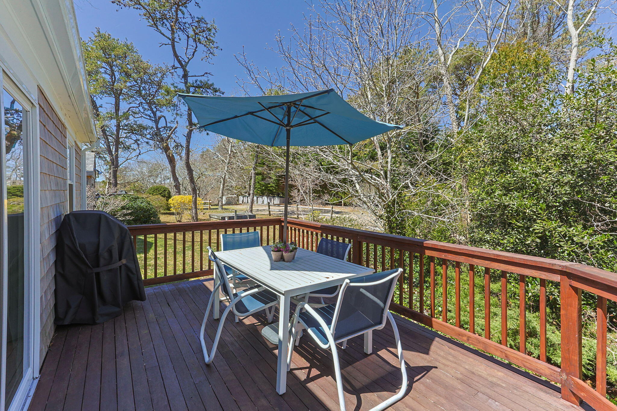 60 Long Avenue, Unit A Wellfleet, MA 02667 - Photo 21 of 28 a view of balcony with wooden floor and outdoor seating