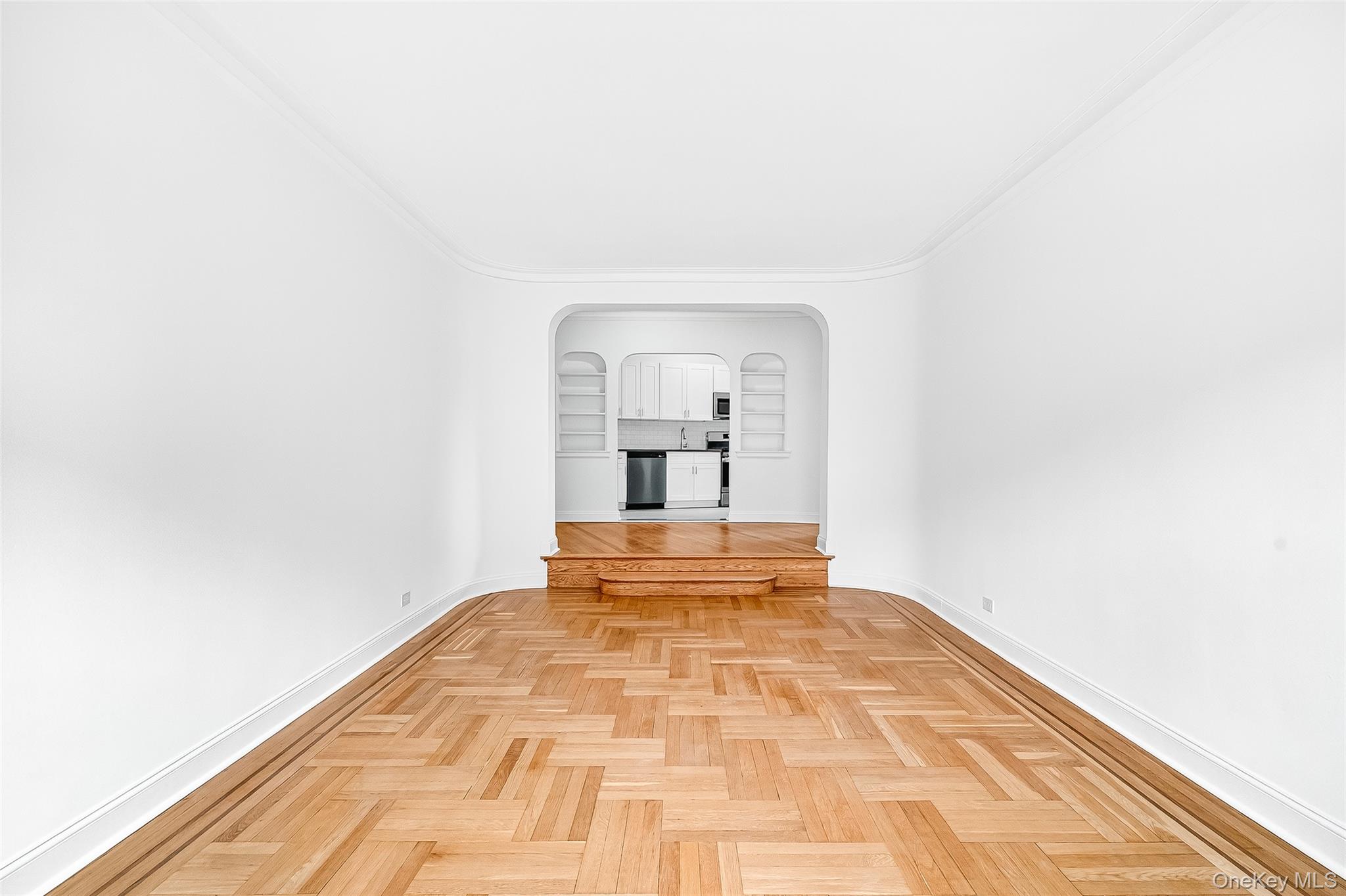 190 East Mosholu Parkway South, Unit 3C Bronx, NY 10458 - Photo 25 of 50 Unfurnished room with arched walkways and ornamental molding