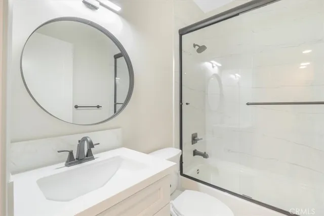 a bathroom with double vanity sink and a mirror
