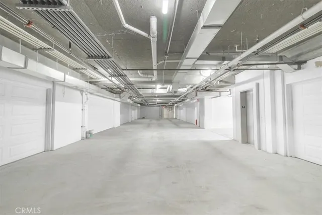 a front view of a house with plants