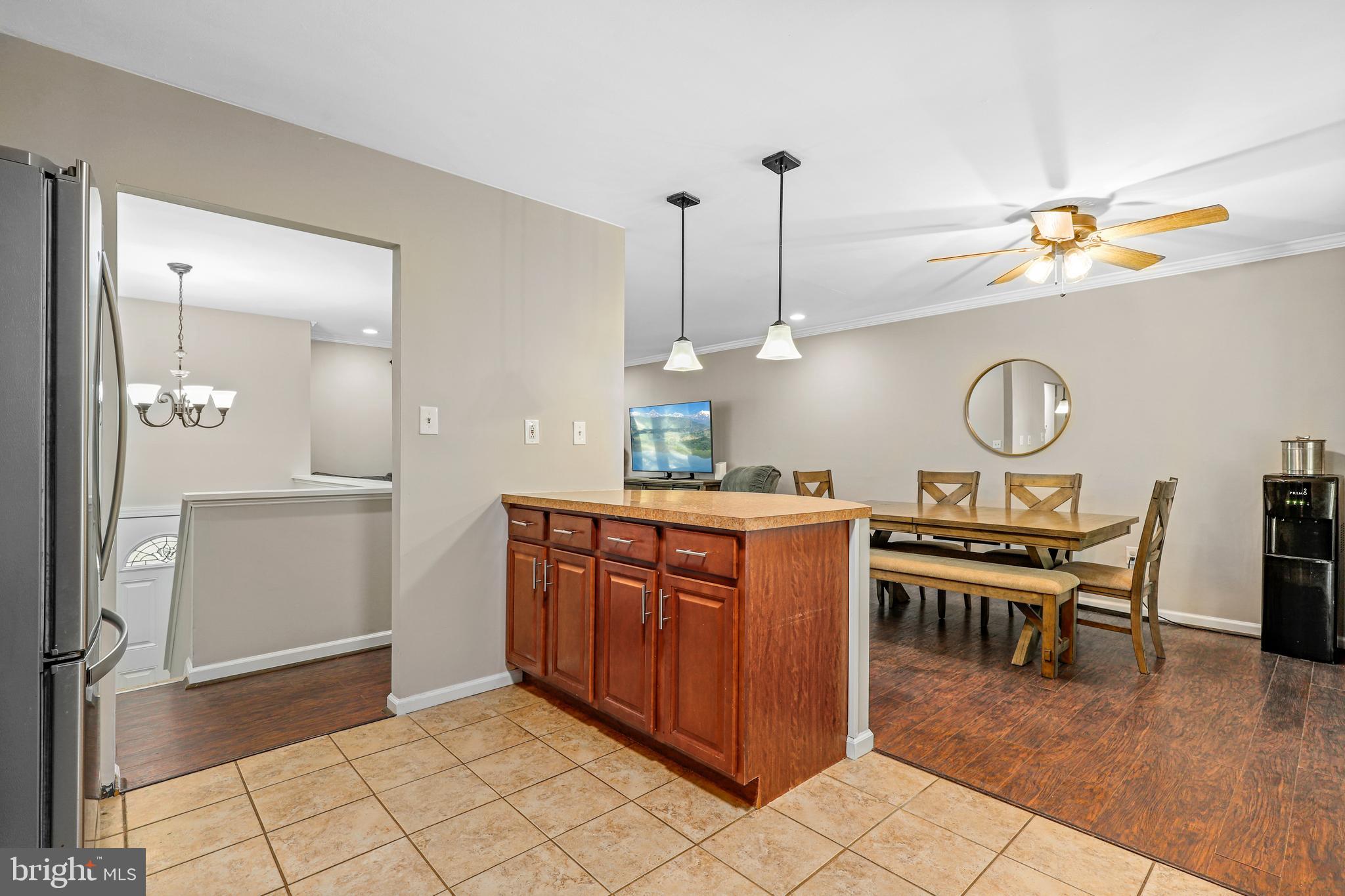 956 Wilson Road Huntingtown, MD 20639 - Photo 11 of 42 a view of kitchen with furniture and wooden floor