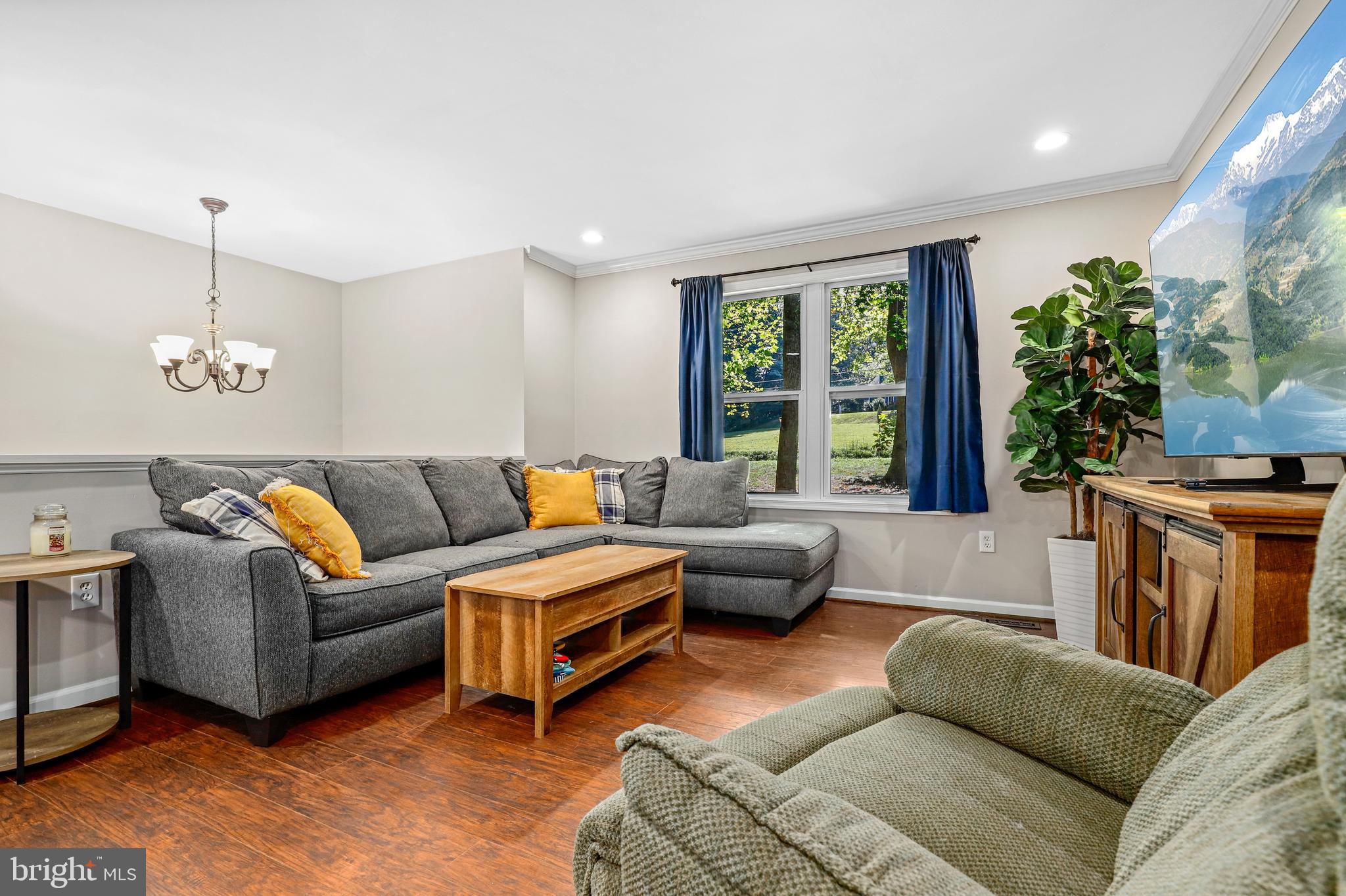 956 Wilson Road Huntingtown, MD 20639 - Photo 16 of 42 a living room with furniture and a large window
