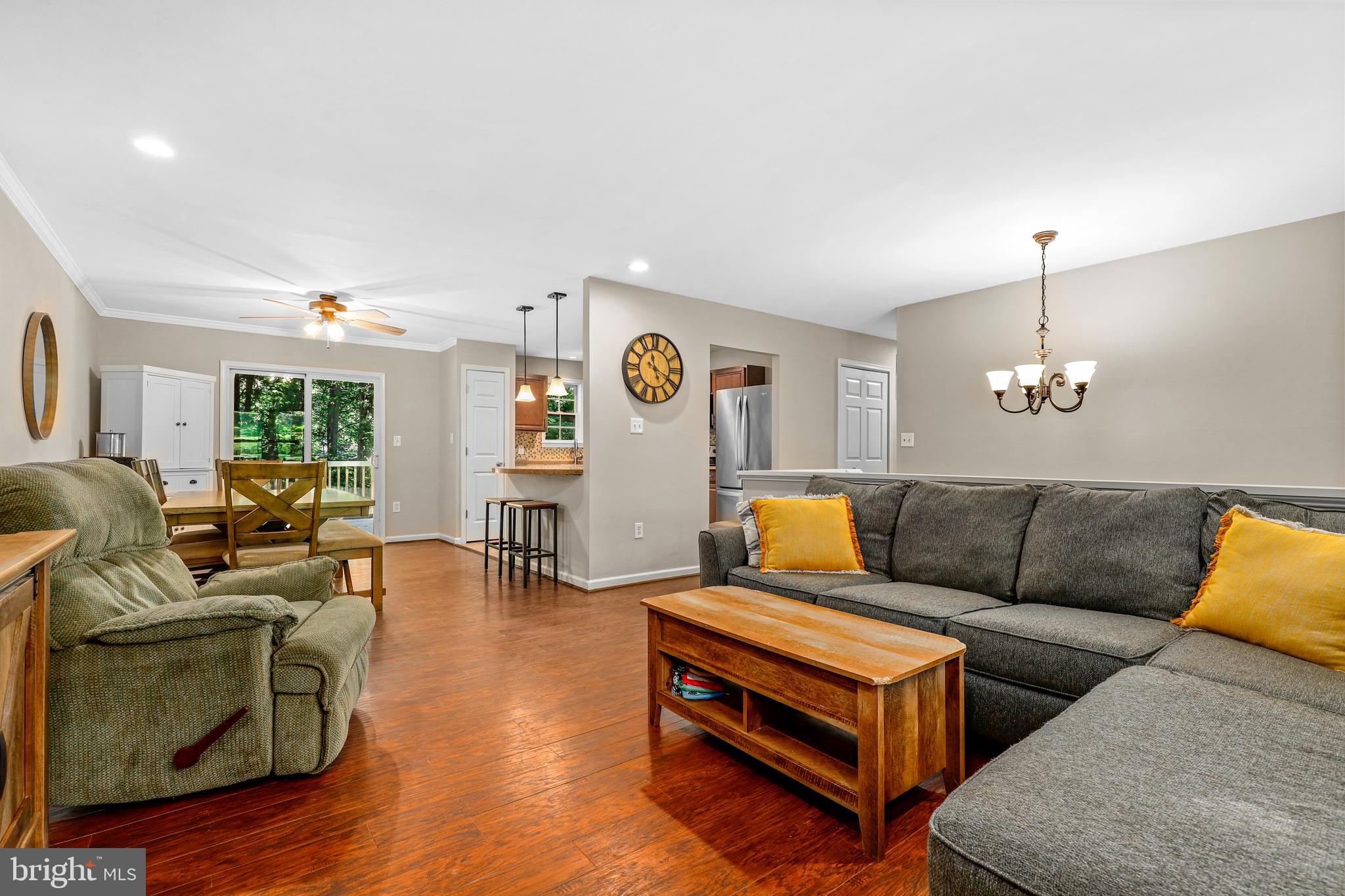 956 Wilson Road Huntingtown, MD 20639 - Photo 18 of 42 a living room with furniture and wooden floor