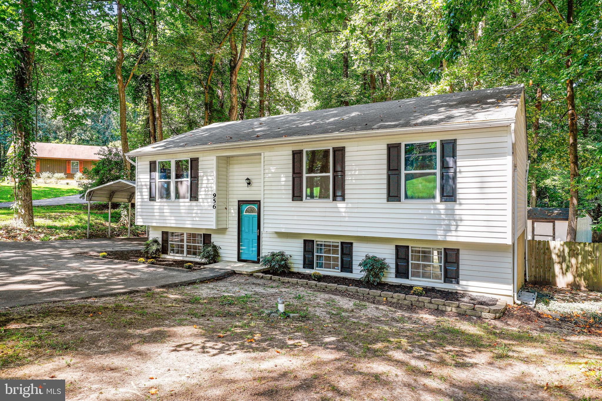 956 Wilson Road Huntingtown, MD 20639 - Photo 2 of 42 a view of a house with a yard and sitting area
