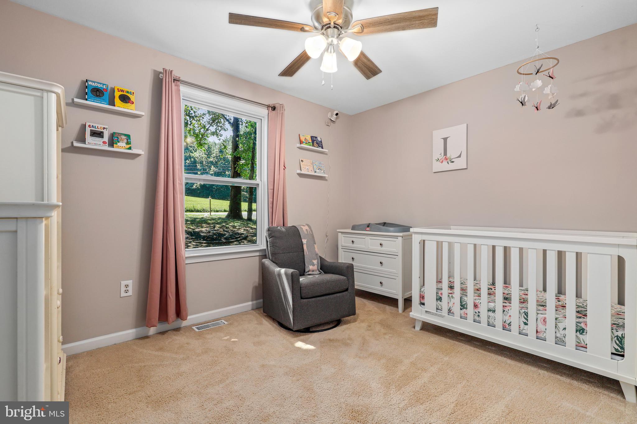 956 Wilson Road Huntingtown, MD 20639 - Photo 23 of 42 a living room with furniture and a window