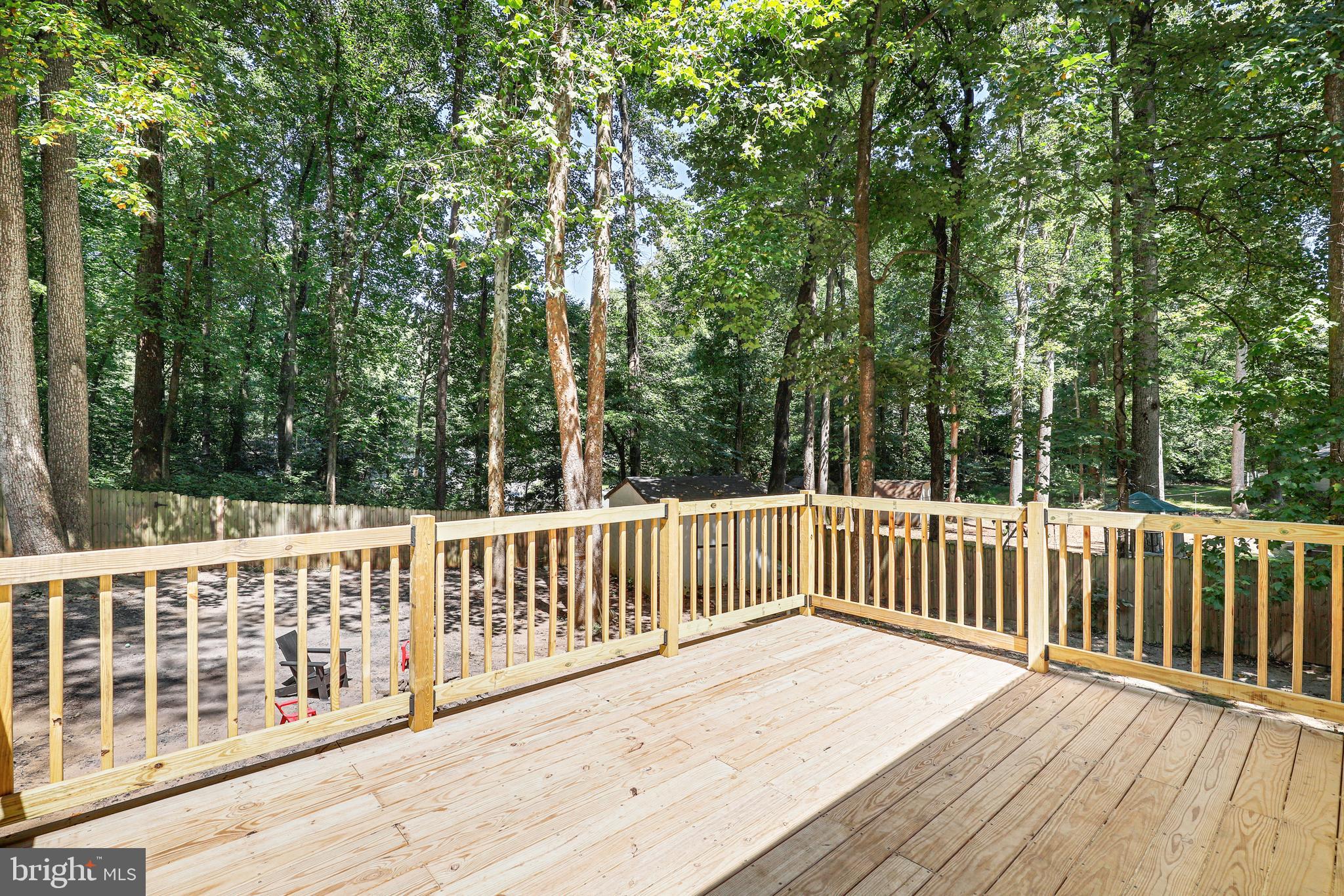 956 Wilson Road Huntingtown, MD 20639 - Photo 36 of 42 a view of deck with a large trees