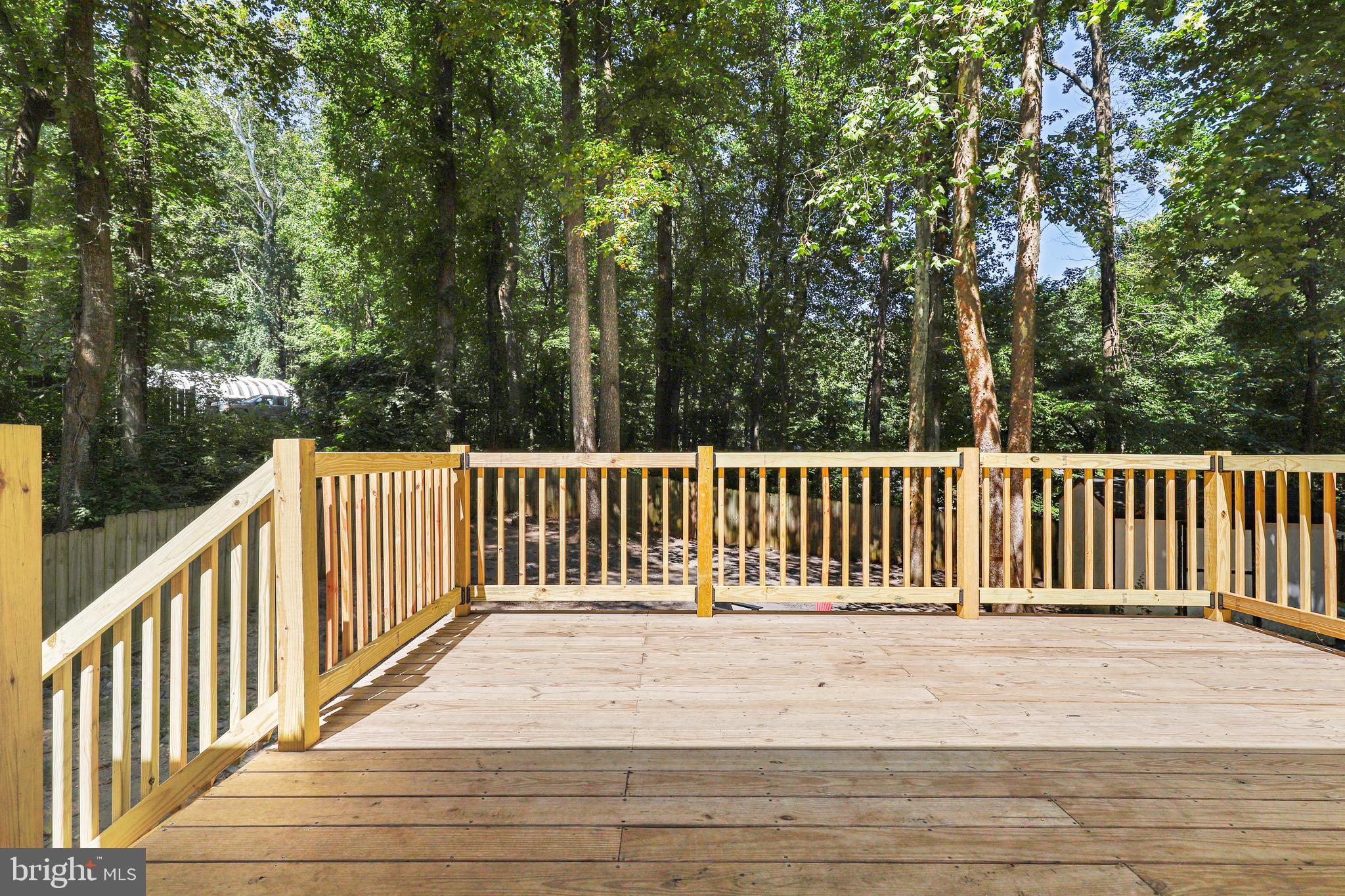 956 Wilson Road Huntingtown, MD 20639 - Photo 37 of 42 a balcony with view of trees in the background