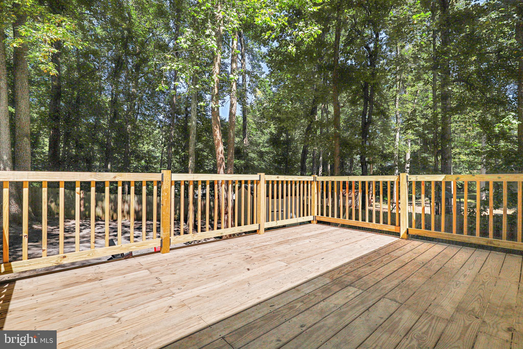 956 Wilson Road Huntingtown, MD 20639 - Photo 38 of 42 a view of a wooden deck