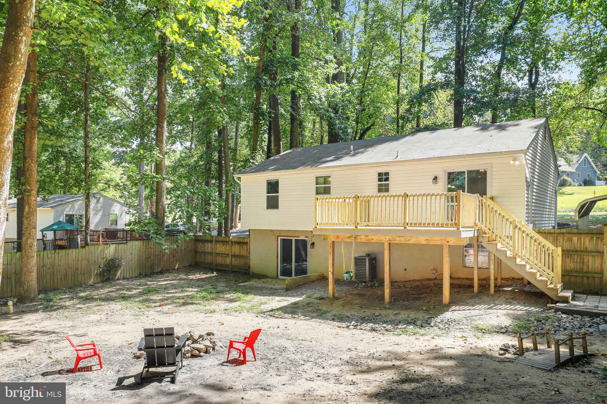 956 Wilson Road Huntingtown, MD 20639 - Photo 39 of 42 a view of a white house with a sink and yard