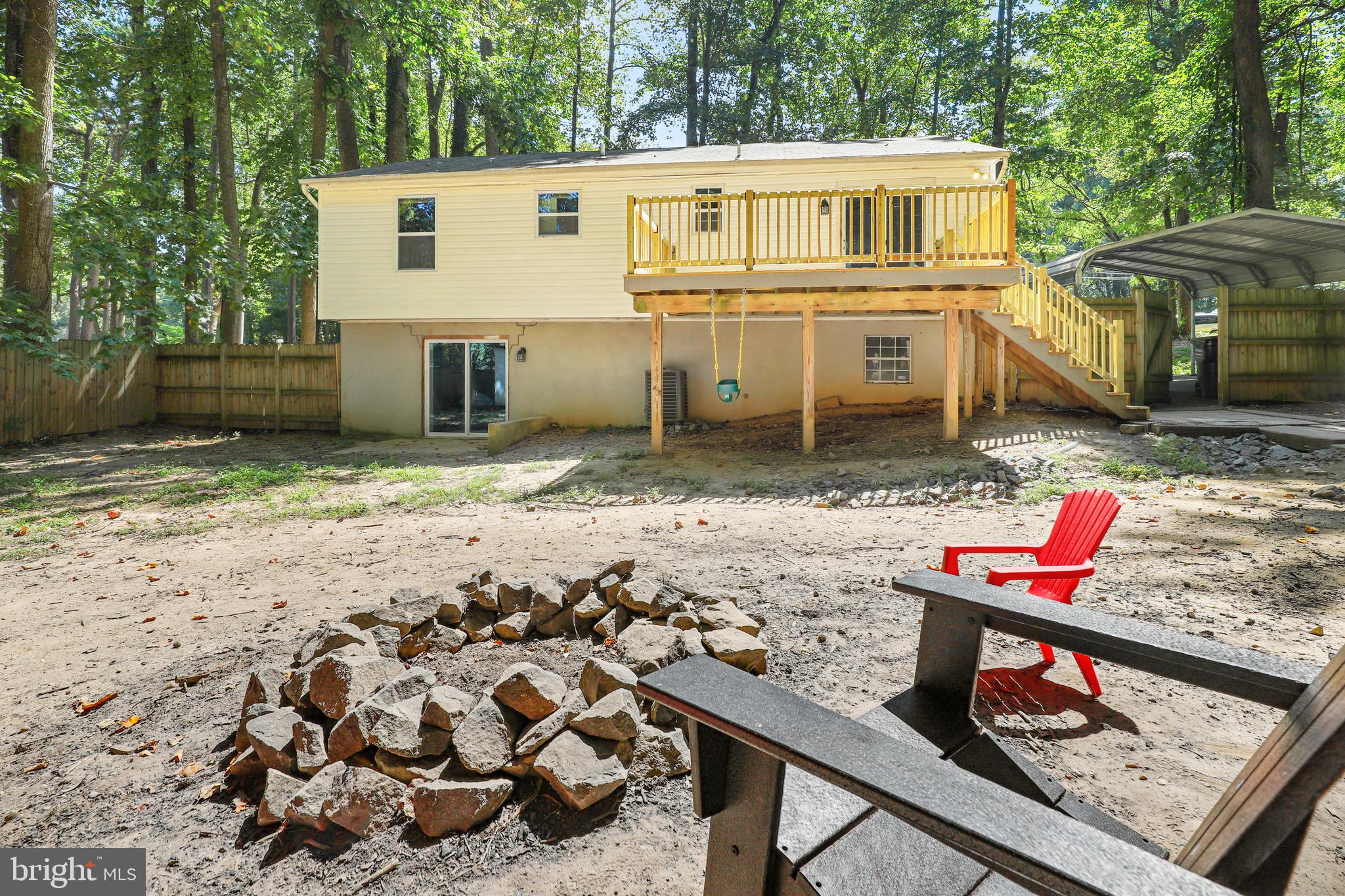 956 Wilson Road Huntingtown, MD 20639 - Photo 40 of 42 a view of a wooden house with a yard