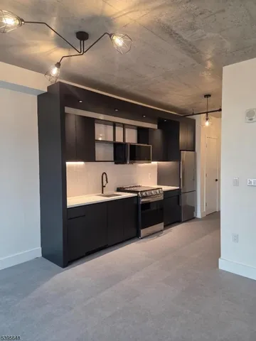 a spacious bathroom with a tub and sink