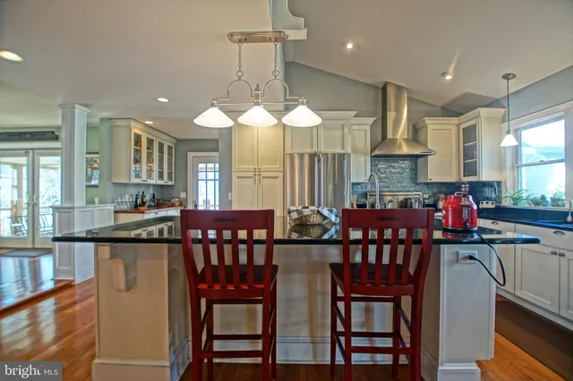 a view of a kitchen with a sink and cabinets