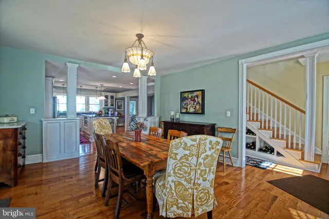 a view of a dining room with furniture window and wooden floor