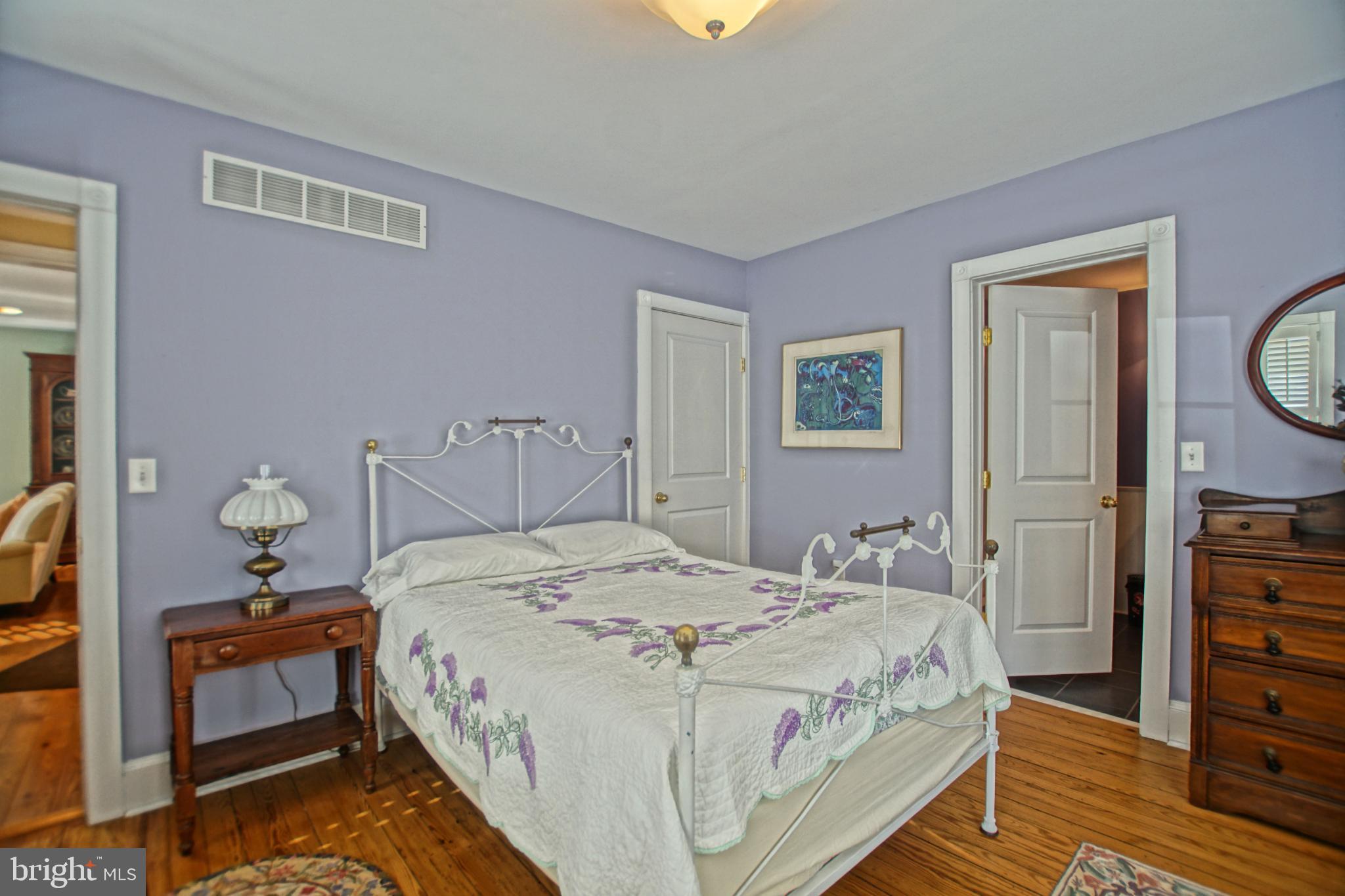 119 Dewey Avenue Lewes, DE 19958 - Photo 20 of 54 Charming bedroom with soft lavender hues.