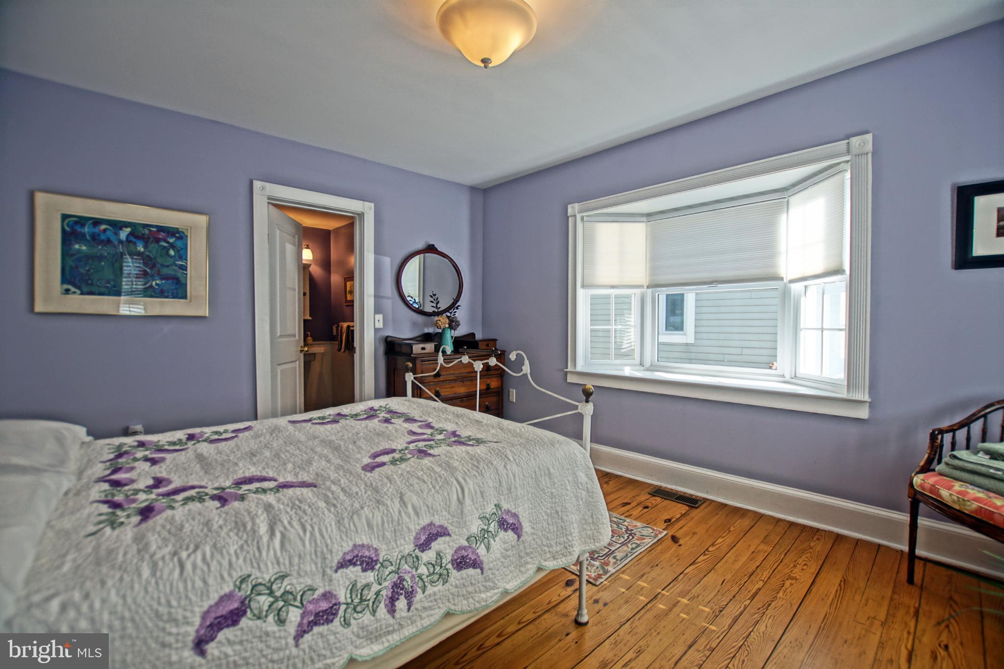 119 Dewey Avenue Lewes, DE 19958 - Photo 21 of 54 Charming bedroom with soft lavender hues.