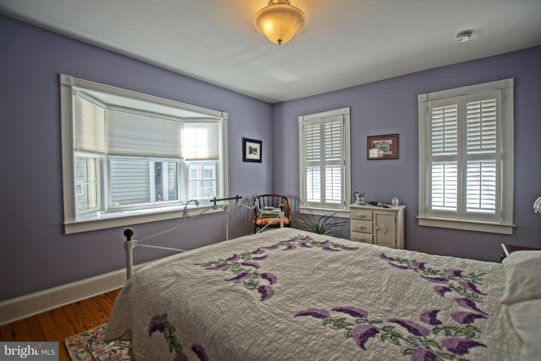 119 Dewey Avenue Lewes, DE 19958 - Photo 22 of 54 Charming bedroom with soft lavender hues.