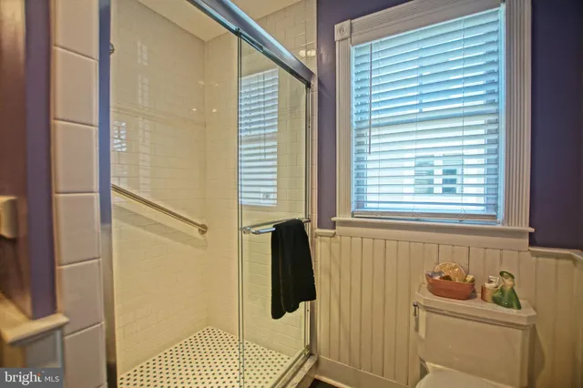 a bedroom with a bed and a table in it