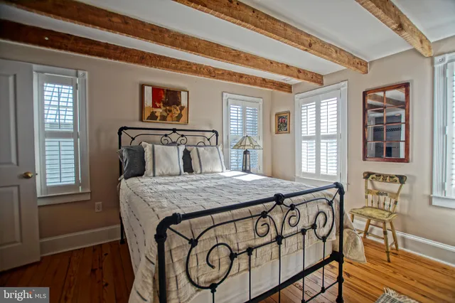 a bathroom with a toilet a sink and a window