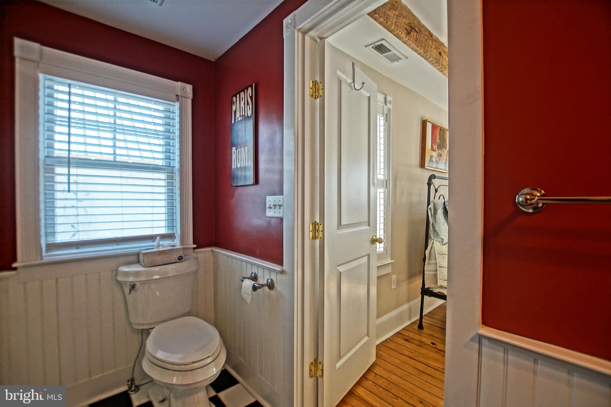 119 Dewey Avenue Lewes, DE 19958 - Photo 30 of 54 Charming bathroom with rich red accents.