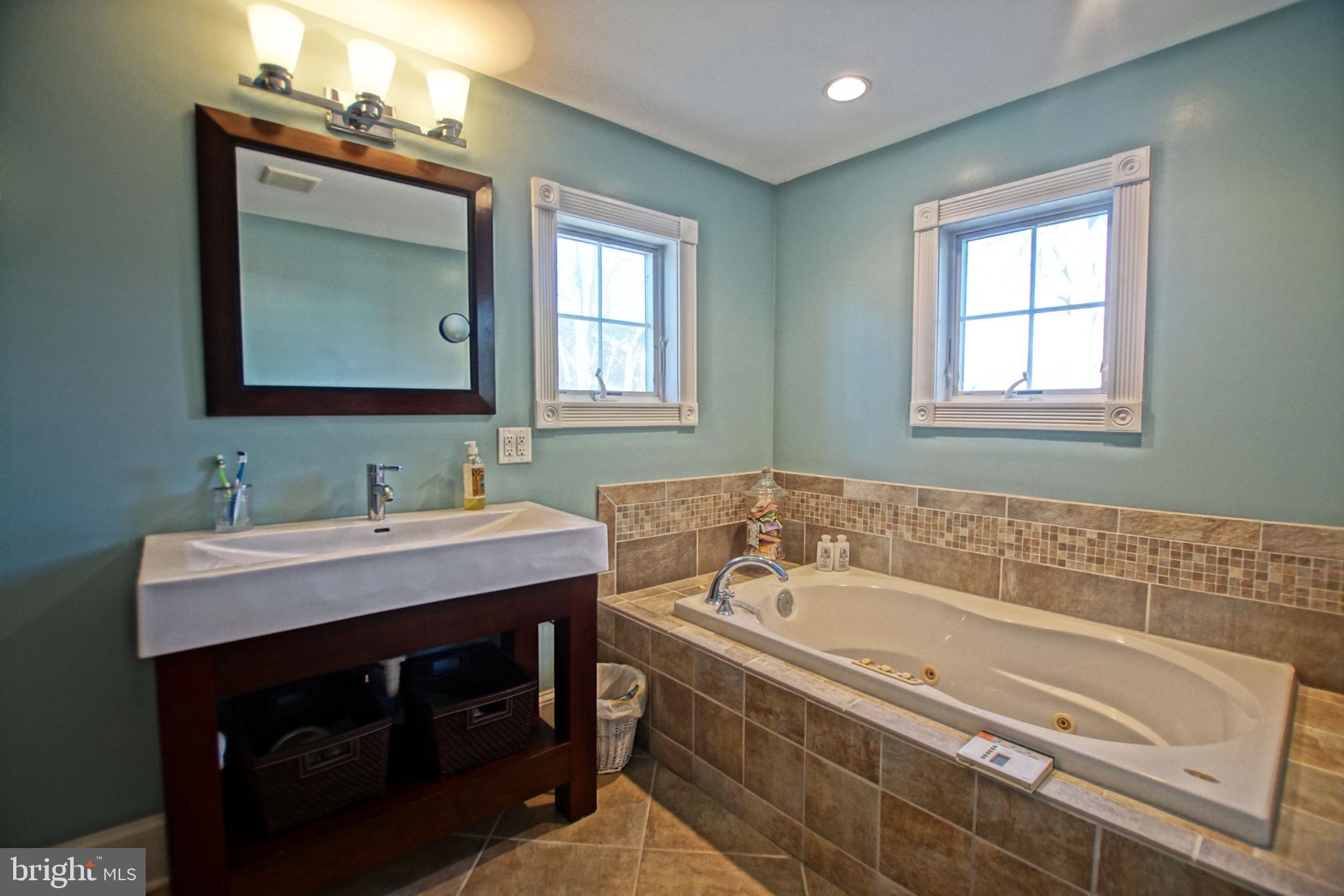 119 Dewey Avenue Lewes, DE 19958 - Photo 38 of 54 Serene bathroom with elegant fixtures.