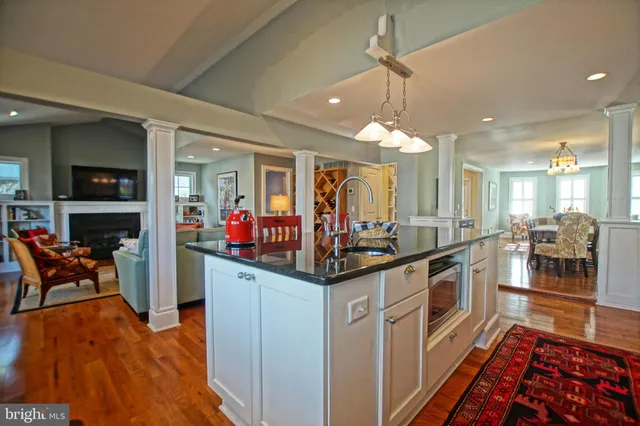 a kitchen with stainless steel appliances a sink and a stove