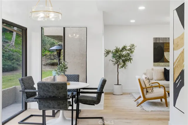 a view of a livingroom with furniture window and wooden floor