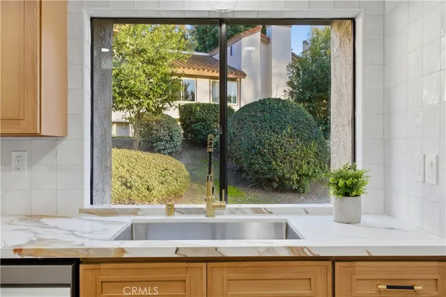 a view of sink and window in a kitchen