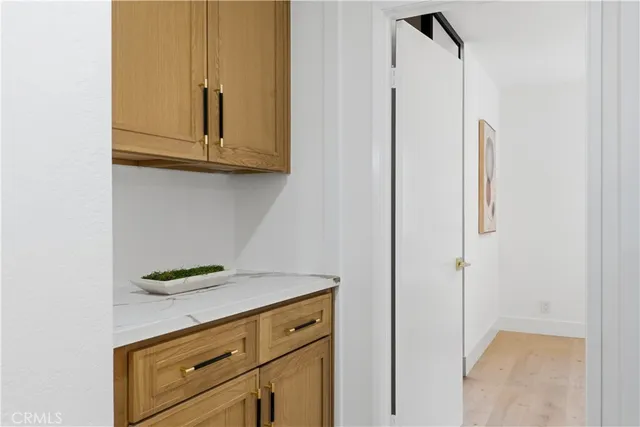 a kitchen with a white cabinets and a stove