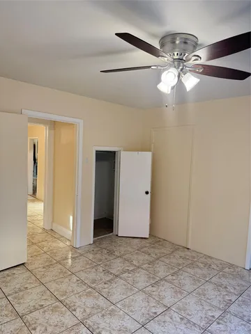 a view of an empty room and glass door