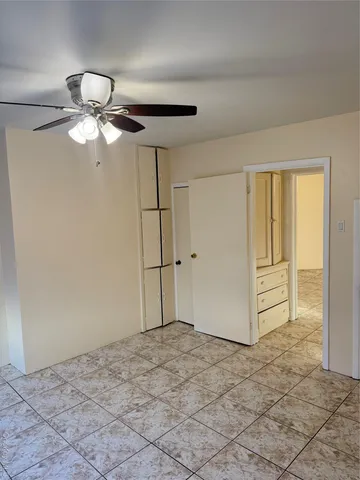 a view of a chandelier fan in a room