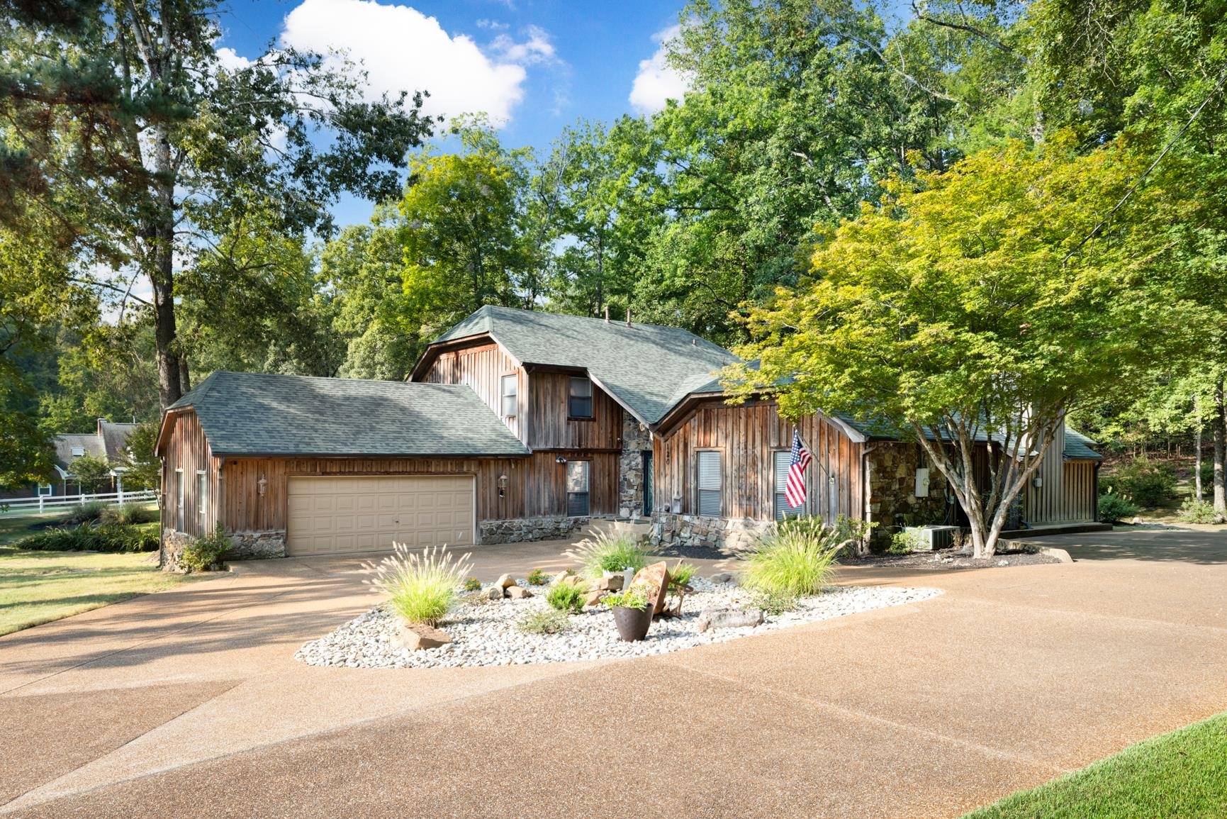 120 Blueberry Road Eads, TN 38028 - Photo 2 of 35 One of a kind custom built home with a 5 year old roof, 1 New HVAC unit, 2 custom built Arkansas Stone Gas Fireplaces, Deck, Outdoor Dining Gazebo, Oversized Garage 34x23, Circular Driveway with Expanded Parking, Well/Septic.