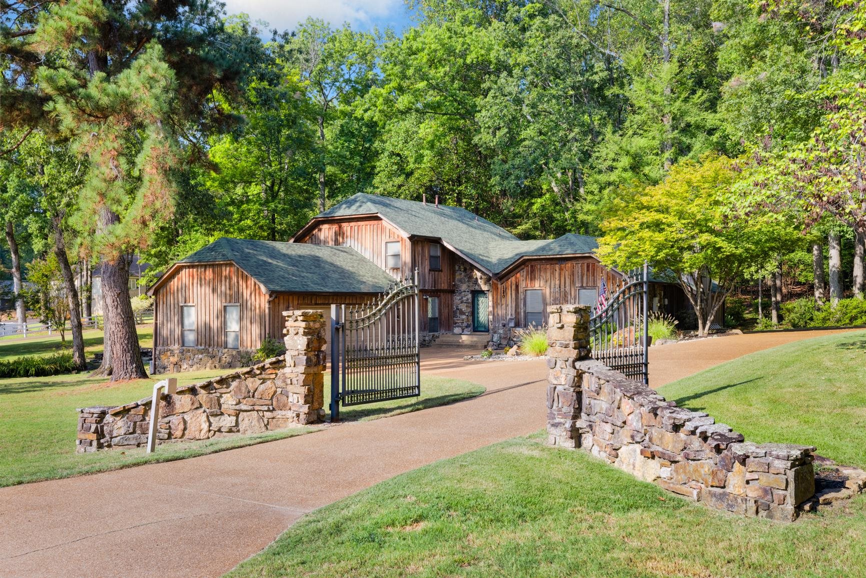 120 Blueberry Road Eads, TN 38028 - Photo 3 of 35 Beautiful Arkansas stone entrance with circular drive and extra parking. Oversized 2 car garage will hold ATV, Side by Side, Kayaks, or small boat. Rural setting with city access to I40/385, minutes to Collierville, Blue Oval or Downtown Memphis.