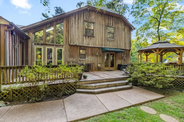 a view of a field with a tree