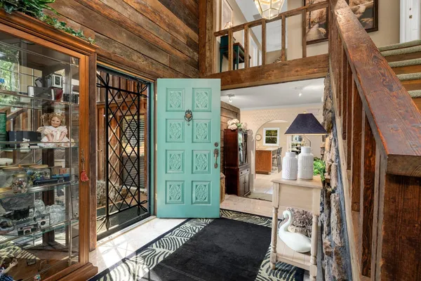 a view of living room with furniture and entryway