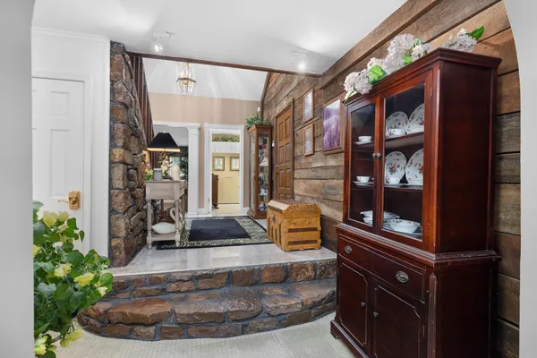 a living room with fireplace furniture and a flat screen tv