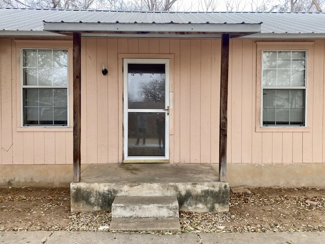 6100 Felix Avenue, Unit B Austin, TX 78741 - Photo 1 of 9 Property entrance featuring a metal roof