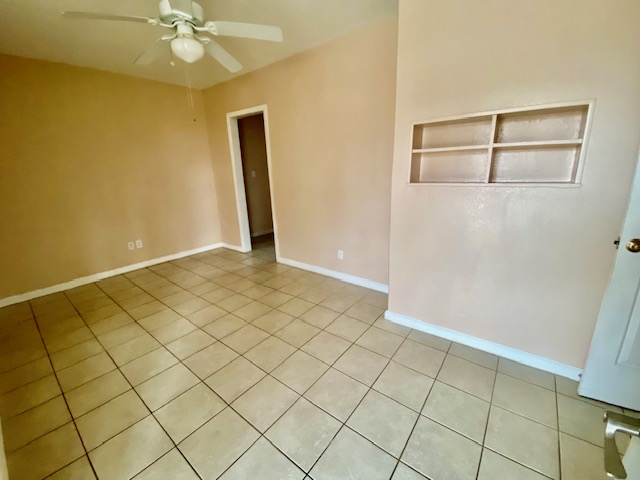 6100 Felix Avenue, Unit B Austin, TX 78741 - Photo 3 of 9 Spare room featuring a ceiling fan and light tile patterned floors