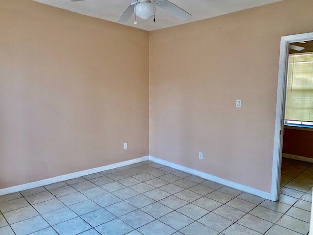 6100 Felix Avenue, Unit B Austin, TX 78741 - Photo 6 of 9 Unfurnished room featuring a ceiling fan and light tile patterned flooring
