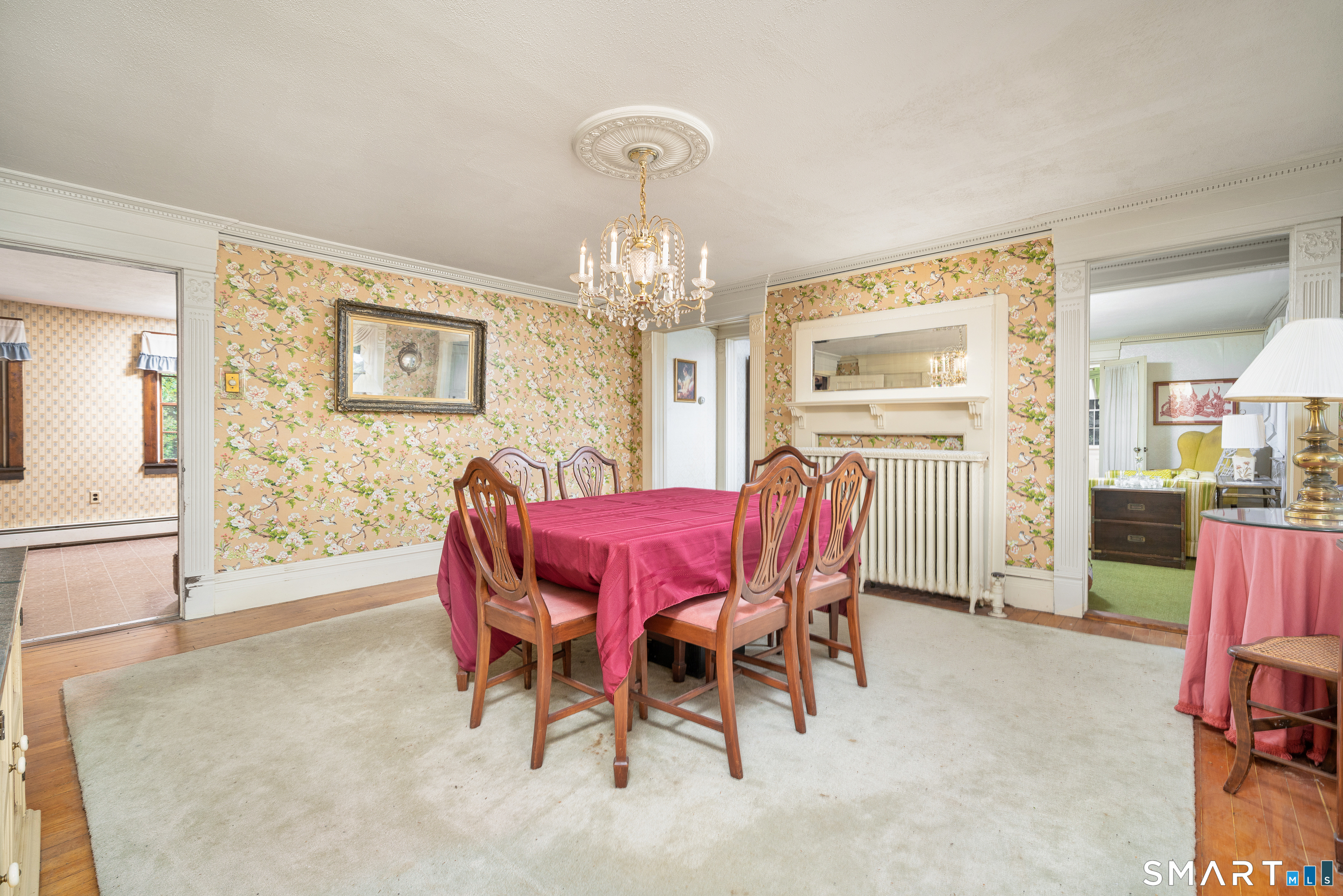 29 South Main Street Windsor Locks, CT 06096 - Photo 10 of 34 Dining room gives the illusion of a fireplace, hardwood floors throughout the dining area