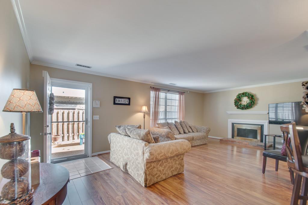 951 General George Patton Road Nashville, TN 37221 - Photo 11 of 25 a living room with fireplace furniture and a wooden floor