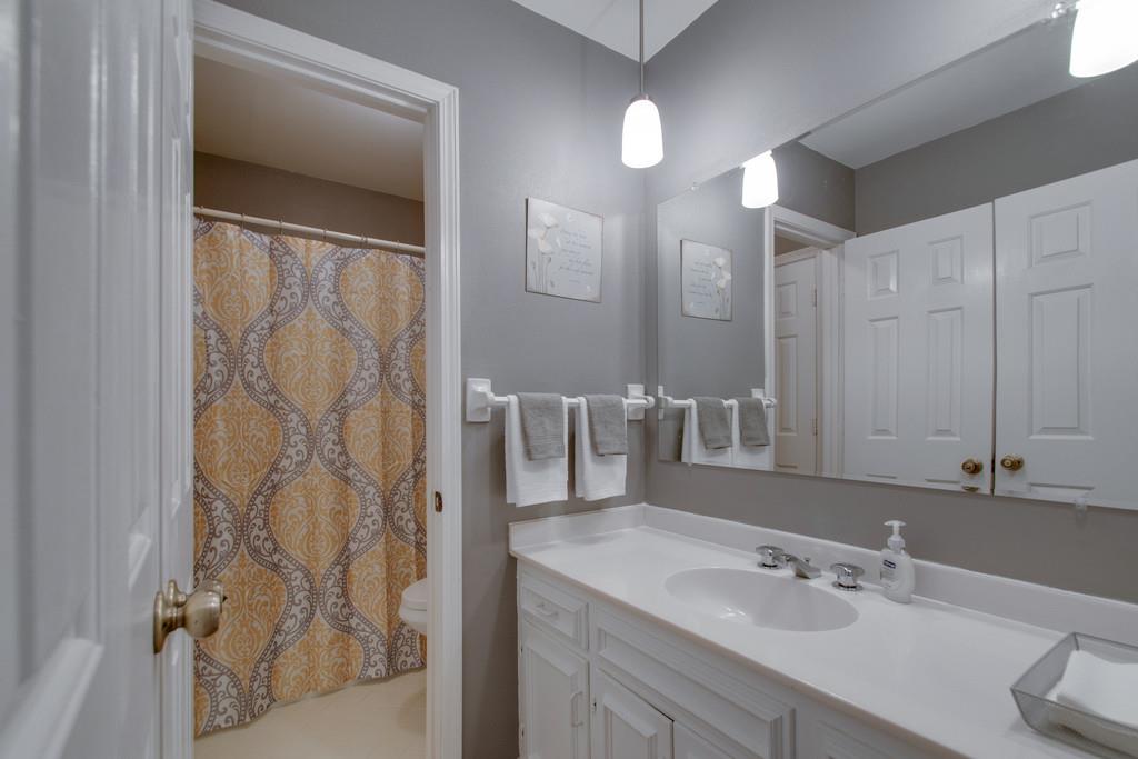 951 General George Patton Road Nashville, TN 37221 - Photo 19 of 25 a bathroom with a double vanity sink and a mirror