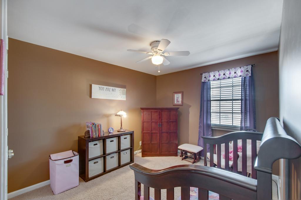 951 General George Patton Road Nashville, TN 37221 - Photo 21 of 25 a bedroom with furniture and a window