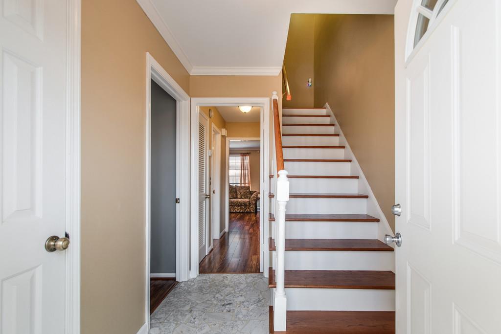 951 General George Patton Road Nashville, TN 37221 - Photo 3 of 25 a view of a hallway with staircase and white walls