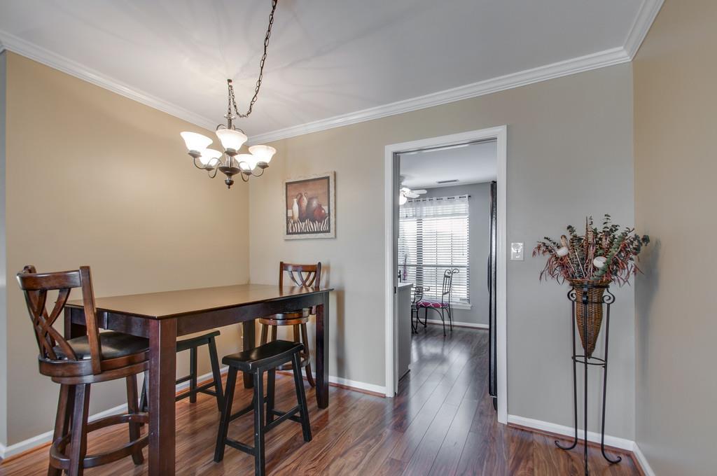 951 General George Patton Road Nashville, TN 37221 - Photo 5 of 25 a view of a dining room with furniture and wooden floor