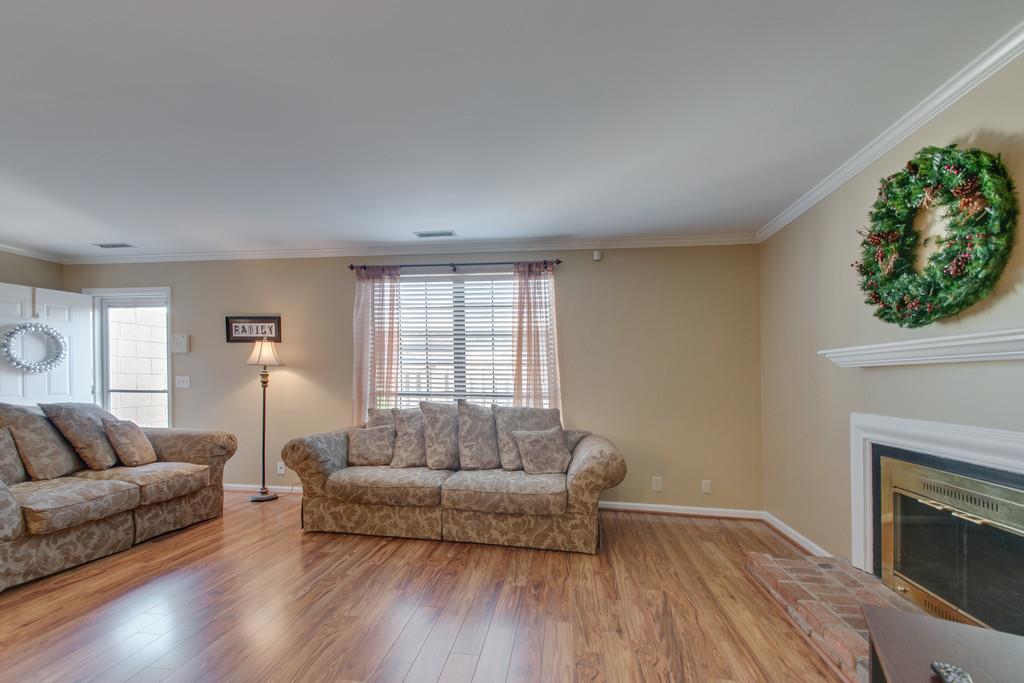 951 General George Patton Road Nashville, TN 37221 - Photo 7 of 25 a living room with furniture and a fireplace